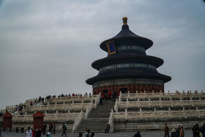 Group of people in temple against building