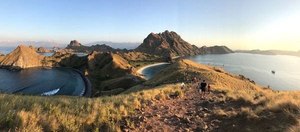 Panoramic view of land and mountains against sky