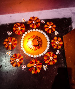 High angle view of orange flowers on table