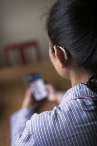 Midsection of woman using mobile phone