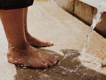 Low section of woman in water