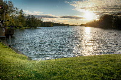 Scenic view of lake against sky during sunset