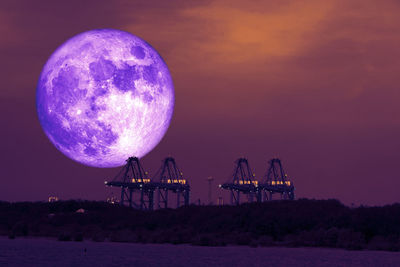 Moon against sky at sunset