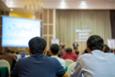 Business people attending seminar 