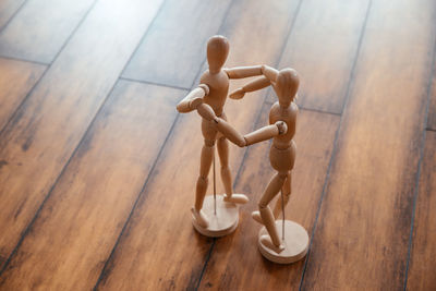 High angle view of figurine on table at home