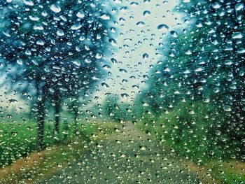 Full frame shot of wet glass window during rainy season