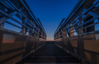 Staircase in city against clear sky