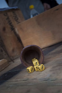 Close-up of dices falling on table