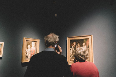 Rear view of a woman in the dark