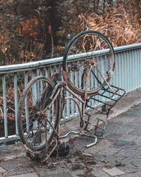 Old bicycle wheel on field