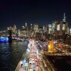 High angle view of illuminated buildings in city at night