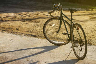 Bicycle parked on road