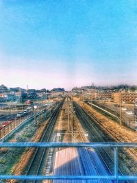 High angle view of railroad tracks against clear blue sky