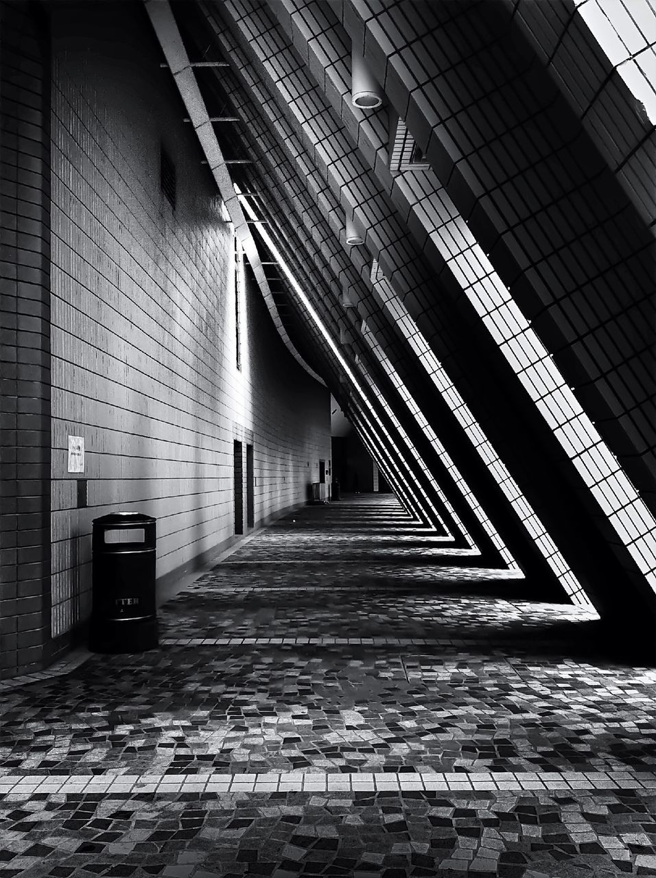 architecture, built structure, the way forward, building exterior, diminishing perspective, cobblestone, city, building, walkway, walking, day, vanishing point, paving stone, colonnade, architectural column, footpath, incidental people, corridor