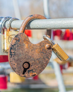 Close-up of padlocks on railing