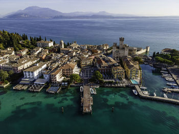 Aerial view  scaligero castle, an ancient fortress along sirmione coastal, lombardy, italy.