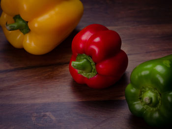Close-up of bell peppers on wooden table