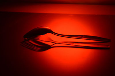Close-up of red light over table against gray background