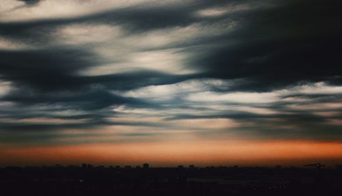 Scenic view of landscape against cloudy sky