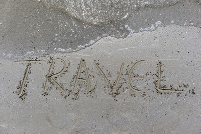 High angle view of footprints on sand