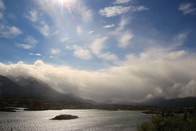 Scenic view of mountains and cloudy sky