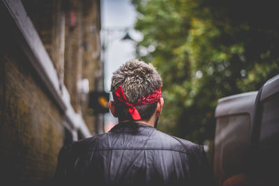 Rear view of man on street in city