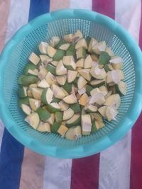 High angle view of chopped vegetables in bowl on table