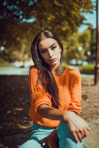 Young woman sitting outdoors