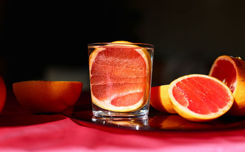 Close-up of orange juice on table
