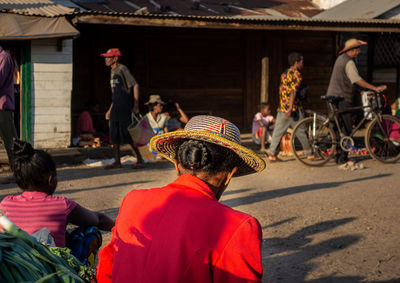 Rear view of people at street in city