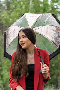 Portrait of smiling woman standing outdoors