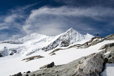 Scenic view of snowcapped mountain against cloudy sky