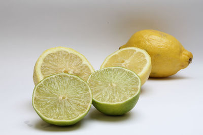 Close-up of oranges against white background