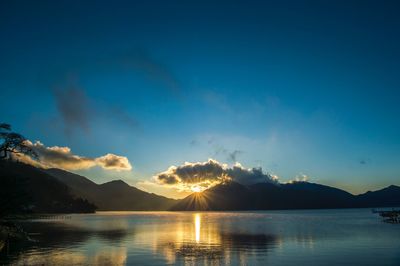 Scenic view of lake against sky during sunset