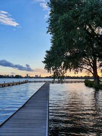 Pier over river against sky