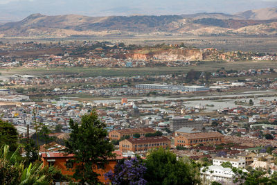 High angle view of townscape and trees in city