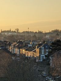 High angle view of illuminated buildings against sky during sunset