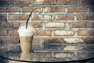 Close-up of drink on wall