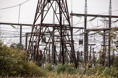 Low angle view of electricity pylons