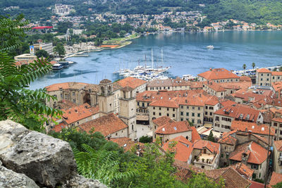 High angle view of townscape by sea