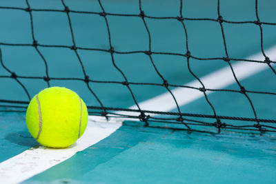 Close-up of tennis ball on court