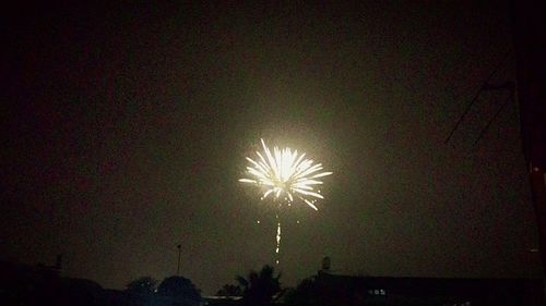 Low angle view of illuminated lights at night