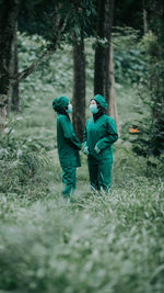 Doctors wearing mask standing in forest
