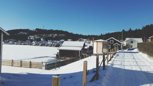 Built structures against clear sky during winter