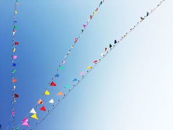 Low angle view of balloons against sky