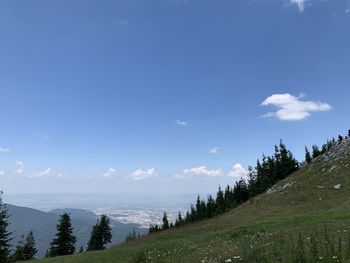 Panoramic view of landscape against blue sky