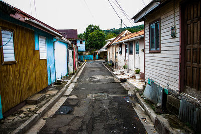 Alley amidst houses in village