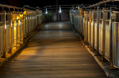 Illuminated footbridge at night