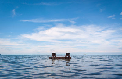 Boat in sea against sky