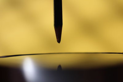 Close-up of water against sky at sunset